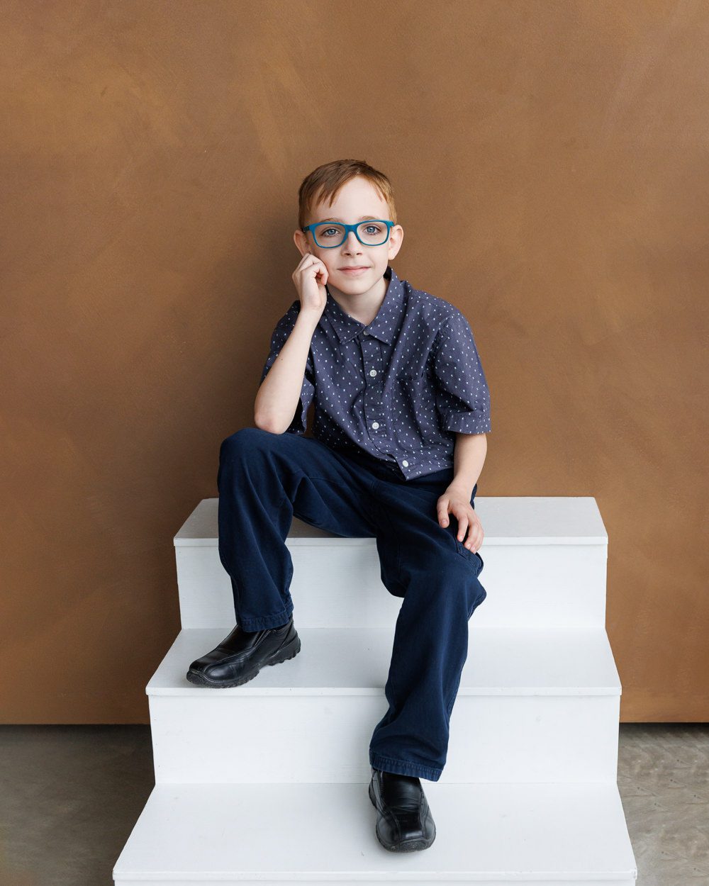 Child actor mid-pose in a playful stance, showing movement and personality during Calgary headshot session by Kate Daniel Photography